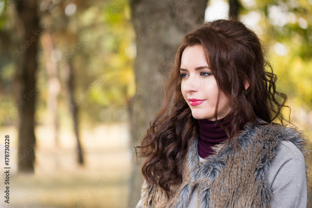 woman is walking in the autumn park woman is walking in the autumn park