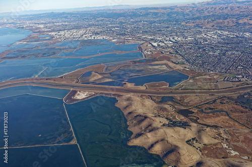 Photography Aerial view of South San Francisco Bay salt flats and foothills.