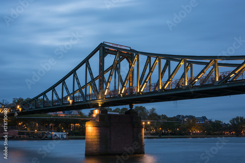 The bridge "Eisener Steg" over the river Main in Frankfurt during blue hour