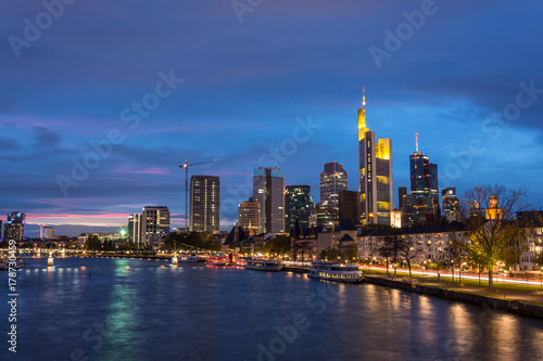 The skyline of Frankfurt with the river Main during blue hour