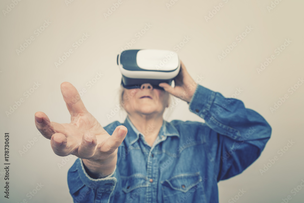 Senior woman with virtual headset or 3d glasses Senior woman with virtual headset or 3d glasses