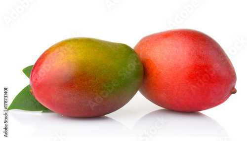Ripe mango fruits with leaves isolated on white background