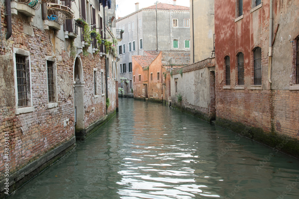 Perspective of a Venice canal between old houses