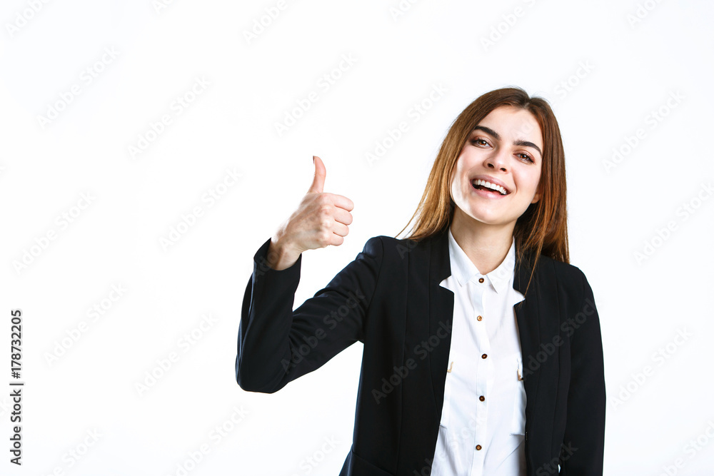Beautiful caucasian brunette businesswoman wears black jacket show thumb up sign on white isolated background with copyspace Beautiful caucasian brunette businesswoman wears black jacket show thumb up sign on white isolated background with copyspace