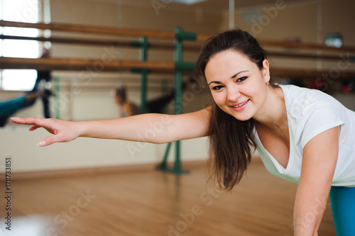 Fitness, sport, exercising lifestyle - Happy women wear in bodysuits doing exercises at gym