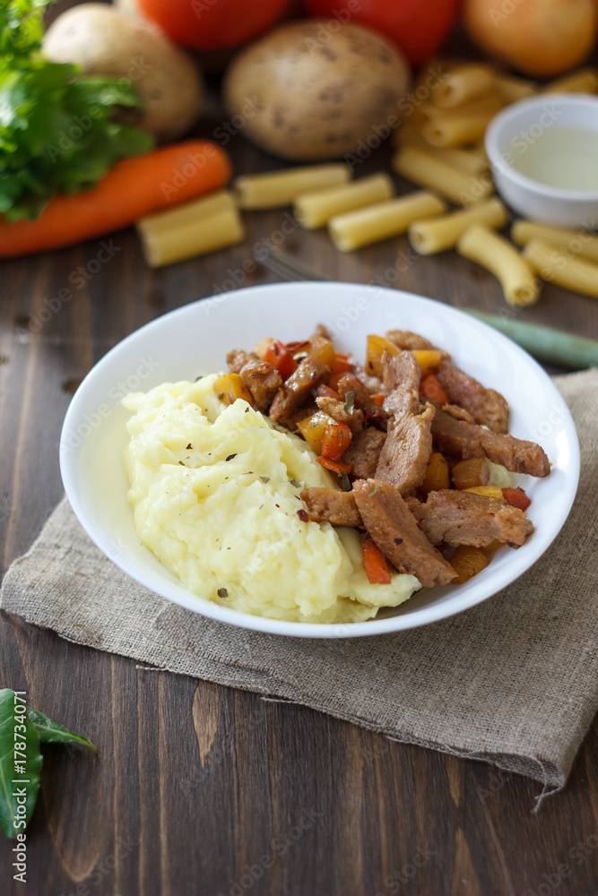 Soy meat with potato puree over kitchen table. Soy meat with potato puree over kitchen table.