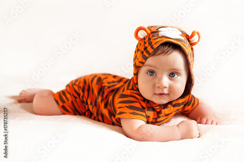 funny boy wearing little tiger suit