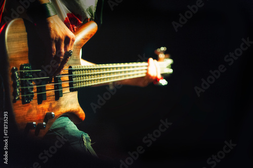 Bassist pop rock during a performance at a concert photo