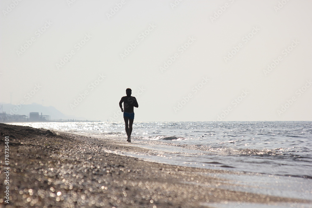 Man running on the beach