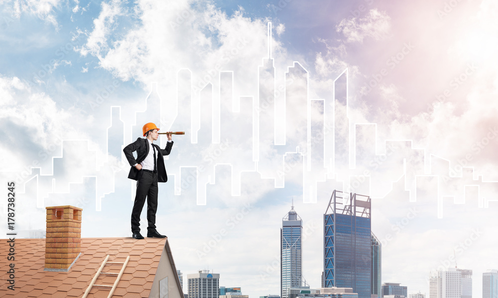 Engineer man standing on roof and looking in spyglass. Mixed media Engineer man standing on roof and looking in spyglass. Mixed media