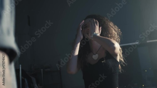 Couple having a quarrel. Woman is crying while man is scolding in the background, love and tears, student young love with emotions