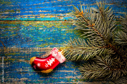 Christmas new year background. Red toy sock Santa Claus on the w