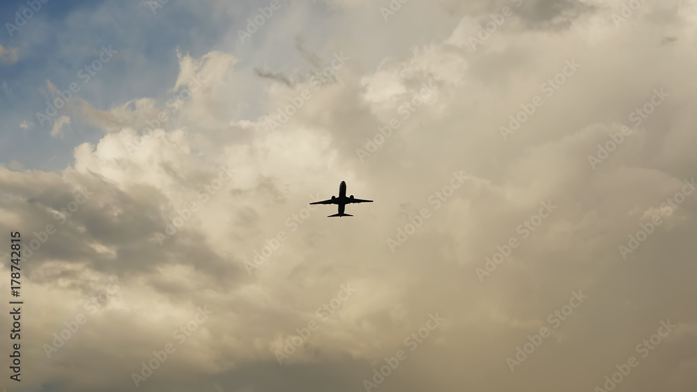 Passenger airplane taking off at sunset against the background of a very beautiful clouds. Passenger airplane taking off at sunset against the background of a very beautiful clouds.