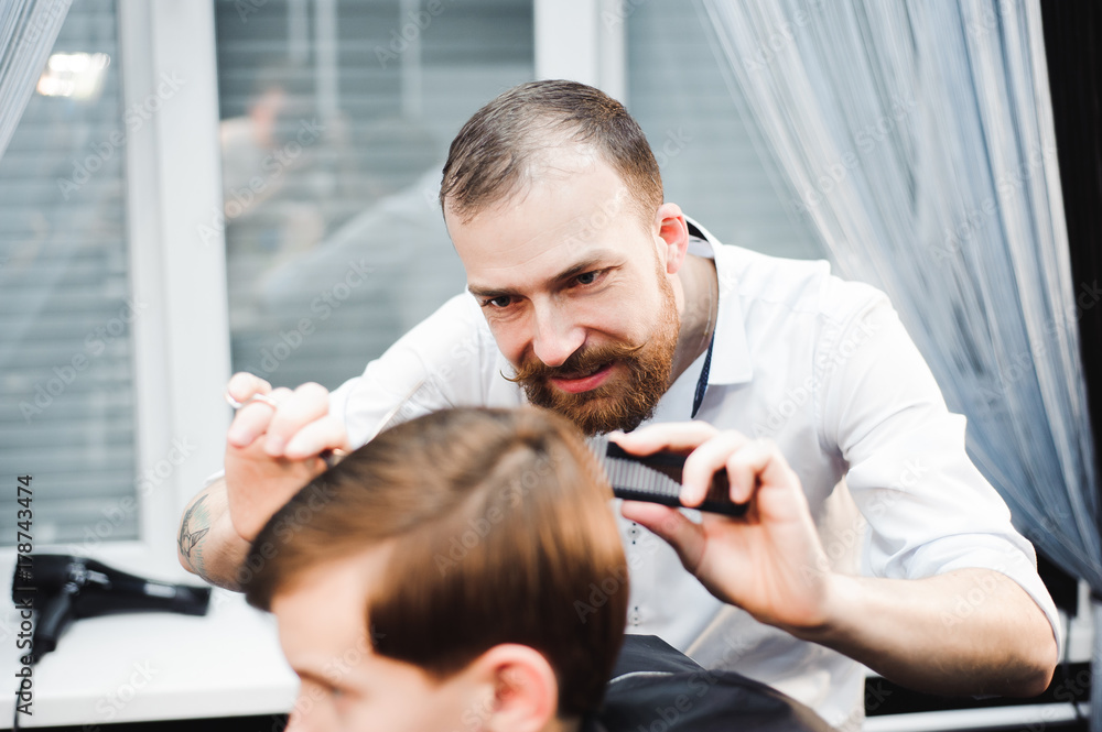 cute young boy getting a haircut cute young boy getting a haircut