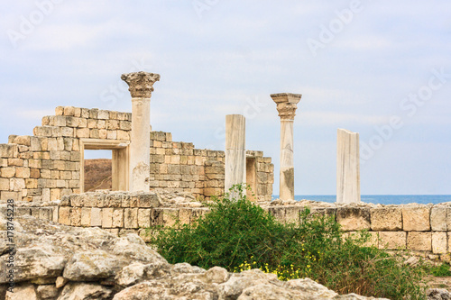 Basilica in the ruins of ancient Greek city of Chersonesus Taurica in the Crimea peninsula under the cloudy sky, Sevastopol, Autumn