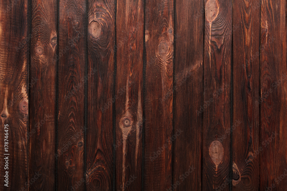 Texture of boards of dark old brown wood Texture of boards of dark old brown wood