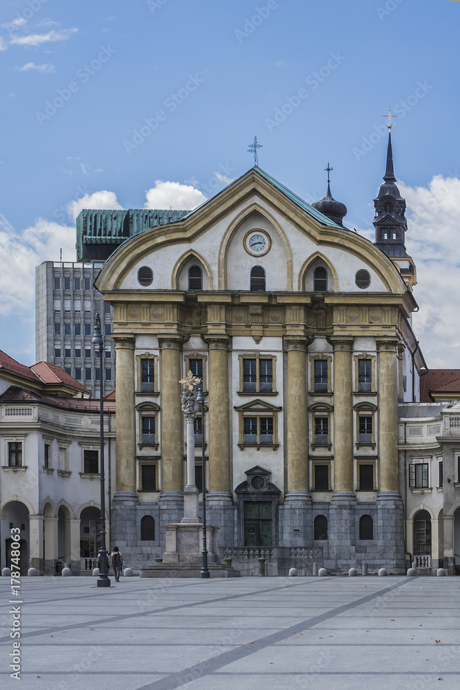 Holy Trinity Column (from 1722) with marble statues in front of the Ursuline Church (Holy Trinity Parish Church in Ljubljana). Ljubljana, Slovenia.
