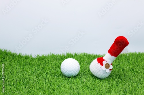 Merry Christmas to golfer with golf ball and Christmas decoration