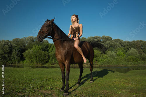 Wild amazon girl on horseback