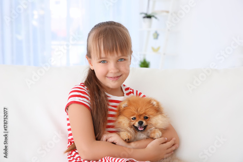 Cute girl with little dog o...