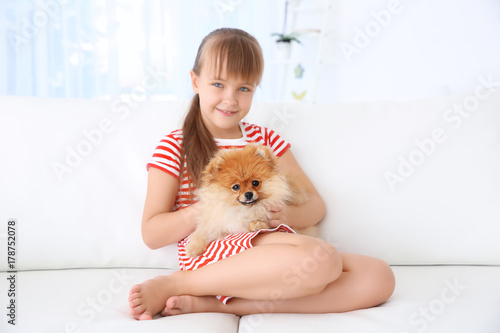 Cute girl with little dog o...