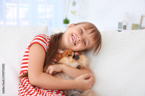 Cute girl with little dog o...