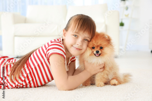 Cute girl with little dog o...