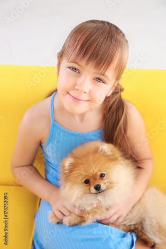 Cute girl with little dog o...
