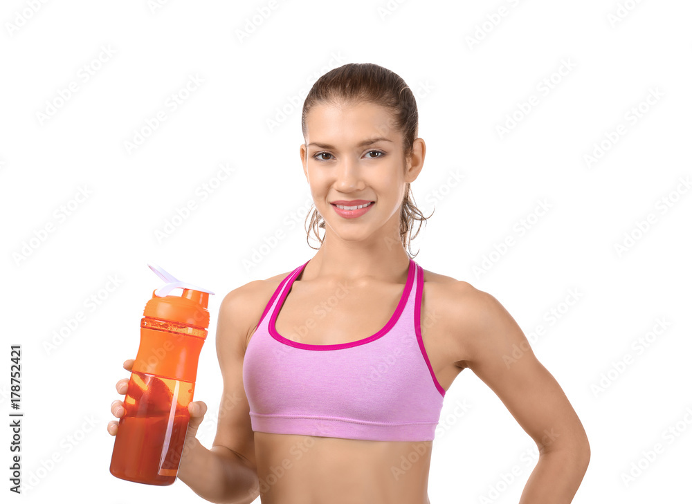 Young woman holding bottle with protein shake on white background Young woman holding bottle with protein shake on white background