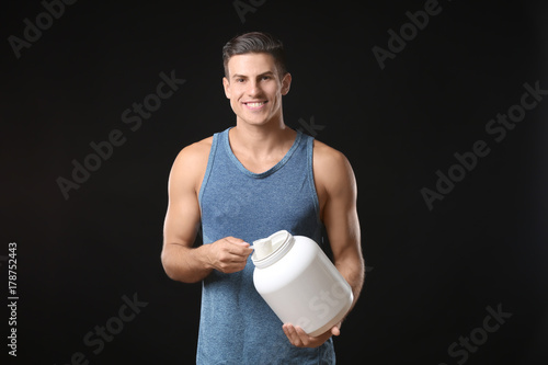 Young man holding white jar...