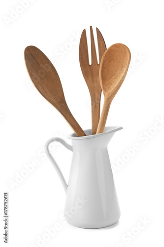 Wooden fork, spoon and spatula in jug, isolated on white