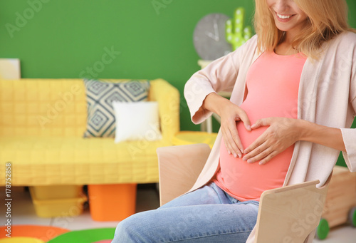Pregnant woman in modern ch...