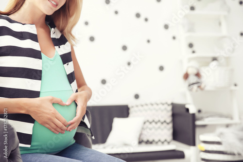 Pregnant woman in modern ch...