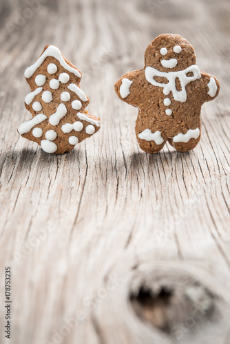 Gingerman and Christmas tree made of gingerbread dough as backgorund and space for text mockup