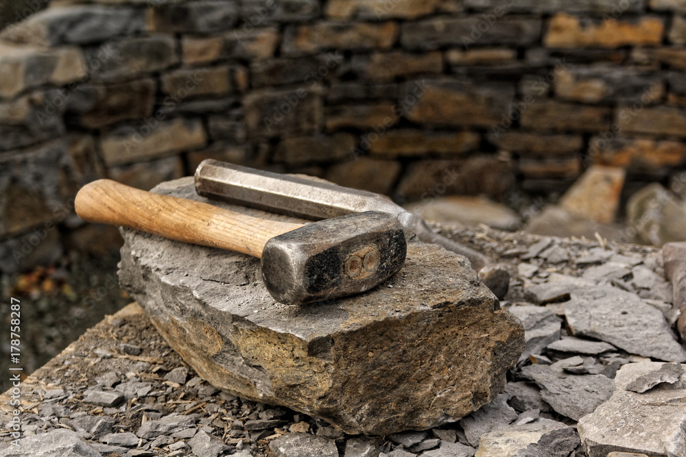 Hammer and Chisel on Basalt Stone Stock Photo | Adobe Stock