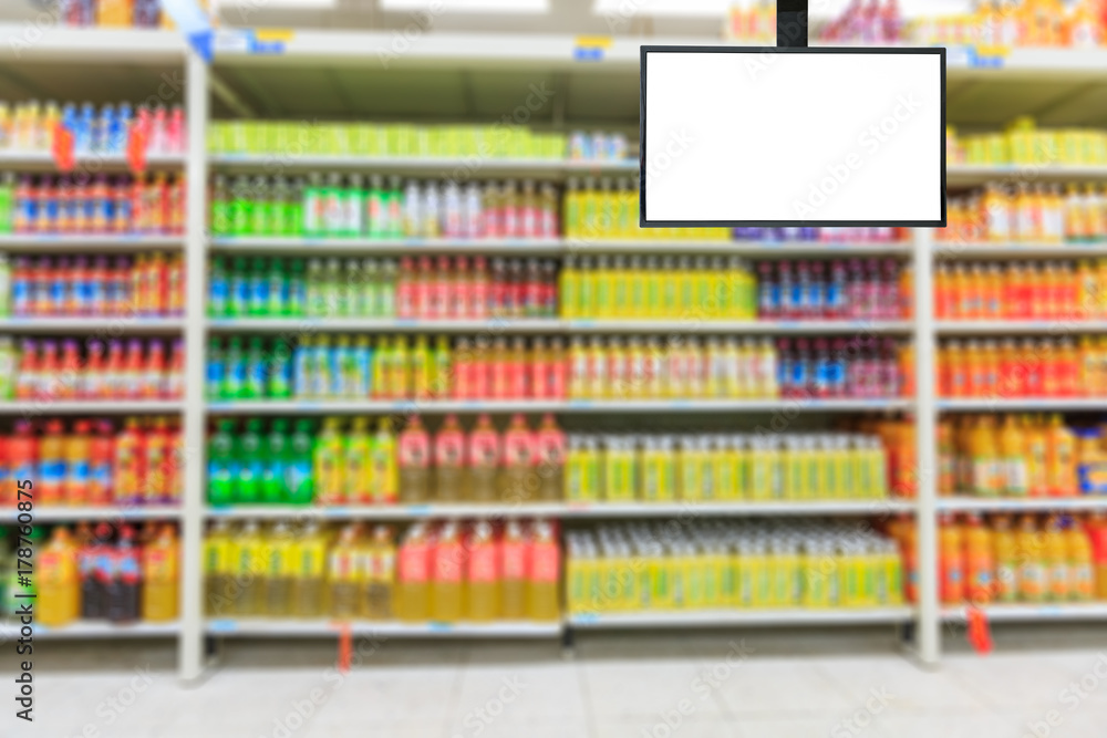 Blank supermarket TV screen and blurred supermarket drinks background