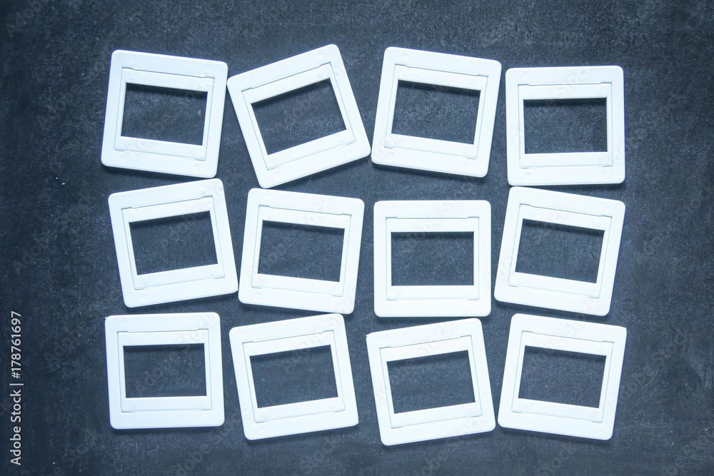 Plastic film slides on chalkboard background Plastic film slides on chalkboard background
