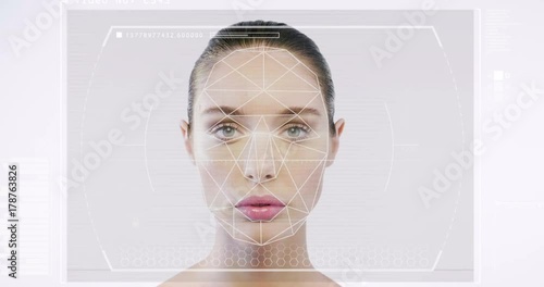 Futuristic and technological scanning of the face of a beautiful woman for facial recognition and scanned person. It can serve to ensure personal safety. Concept of:  future, security, scanning.
