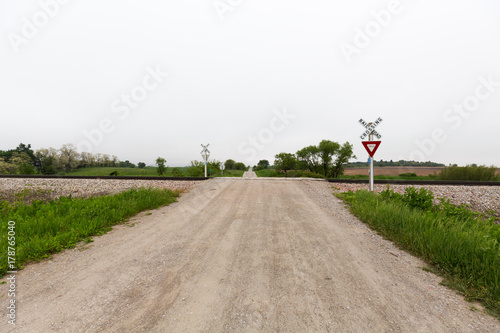 Railroad crossing in rural Iowa on a spring day.