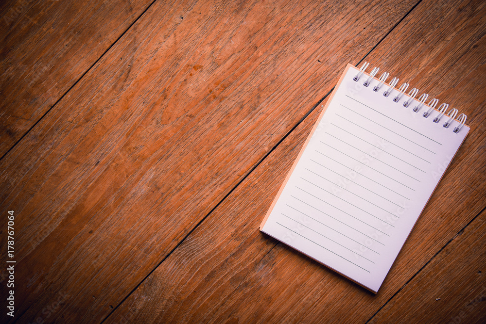 Top view of notebook paper on Office desk table. Top view of notebook paper on Office desk table.