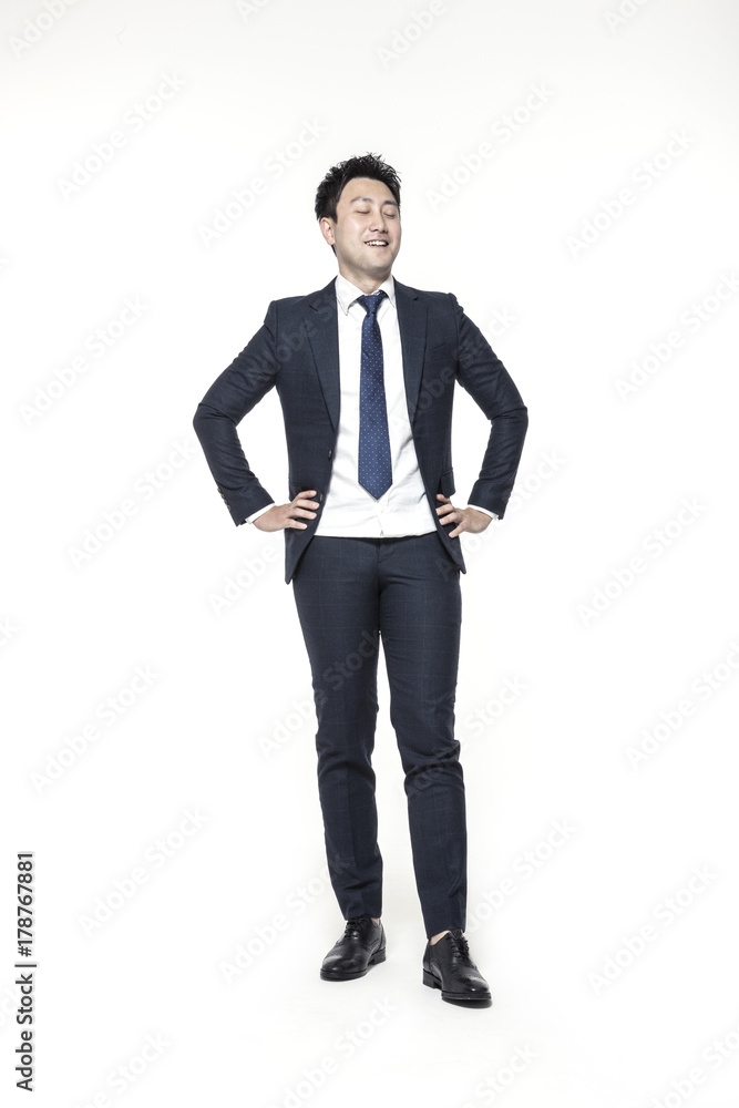 asian business man stand up with a smile isolated white. asian business man stand up with a smile isolated white.