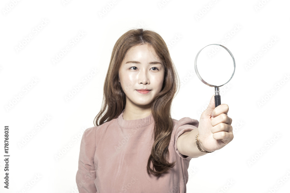 asian business woman hand hold a magnifier isolated white. asian business woman hand hold a magnifier isolated white.