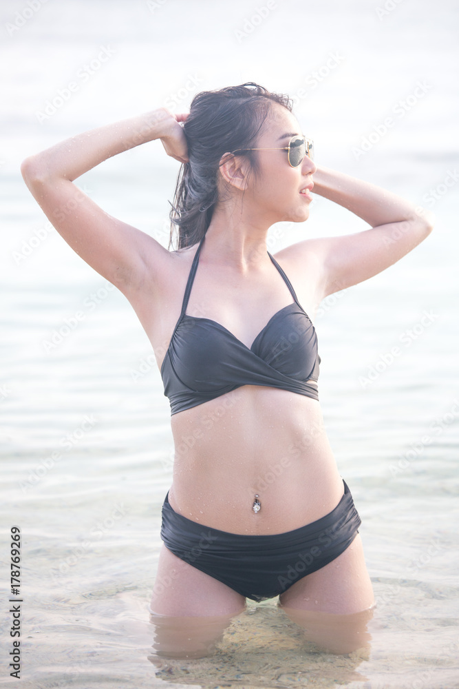 Portrait of Woman posing at the Beach with Attractive Smiling, People with Summer Concept. Portrait of Woman posing at the Beach with Attractive Smiling, People with Summer Concept.