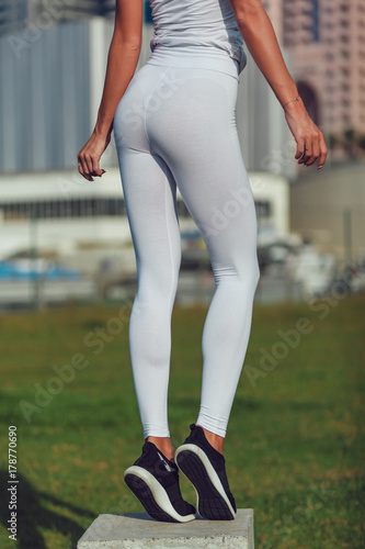 Legs of a sexy girl in white leggings. Mock-up. Outdoor. Stock Photo |  Adobe Stock