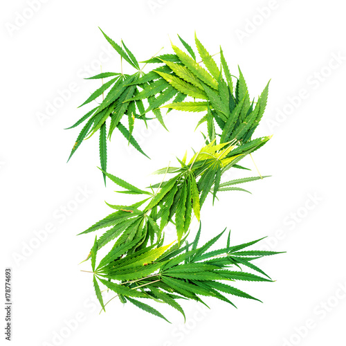 Number two made from green cannabis leaves on a white background. Isolated