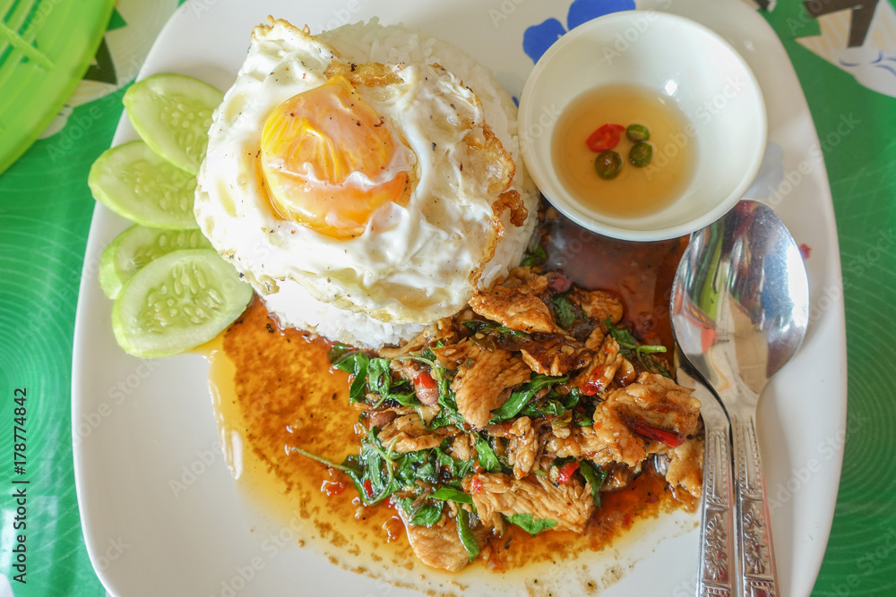 Fried chicken basil on top cooked rice, thai food. Fried chicken basil on top cooked rice, thai food.