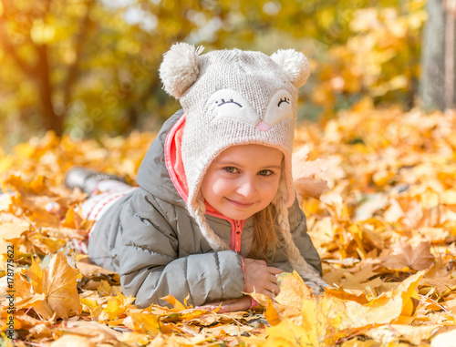 little girl in an autumn forest