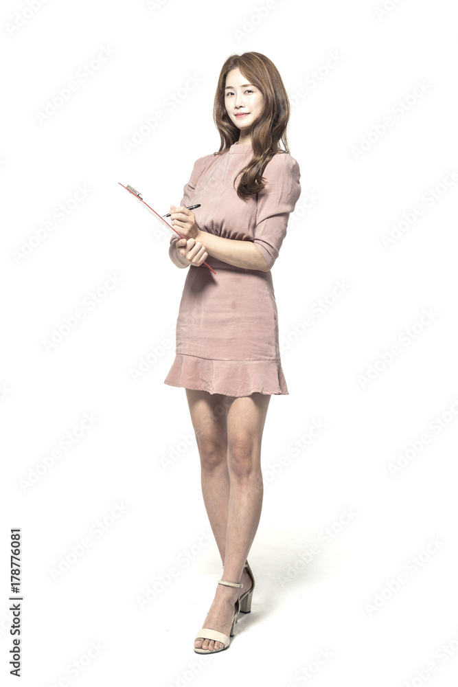 business woman standing up with clipboard and pencil at the studio business woman standing up with clipboard and pencil at the studio