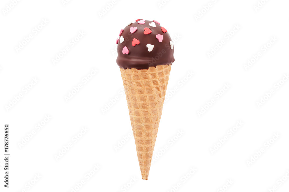 Chocolate cake pop in waffle cone for ice cream, decorated with pink and white confectionery sprinkles in the form of heart. Isolated. Picture for a menu or a confectionery catalog. Chocolate cake pop in waffle cone for ice cream, decorated with pink and white confectionery sprinkles in the form of heart. Isolated. Picture for a menu or a confectionery catalog.