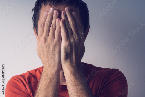 Photography Ashamed man covering face